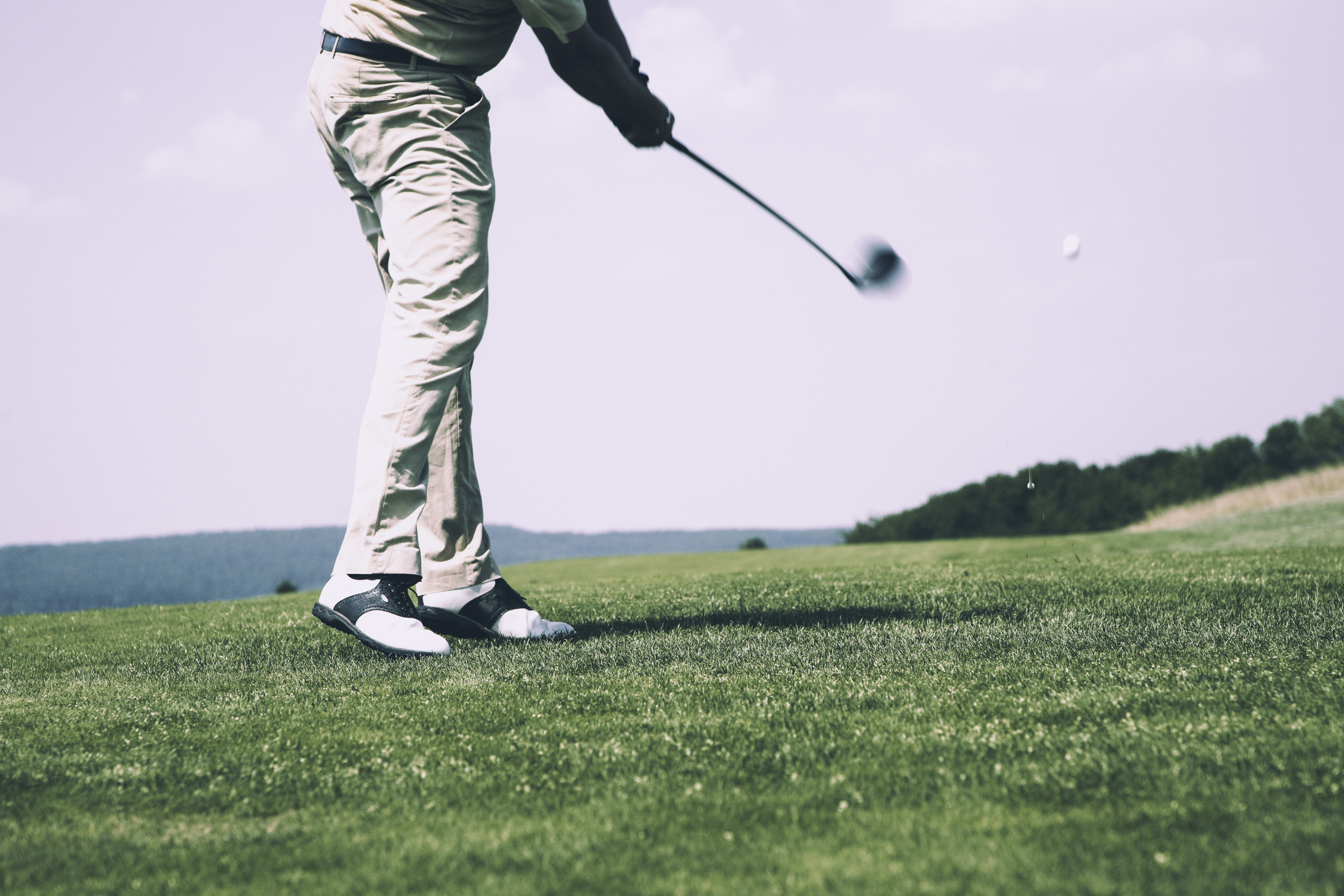Golfer hitting a golf ball